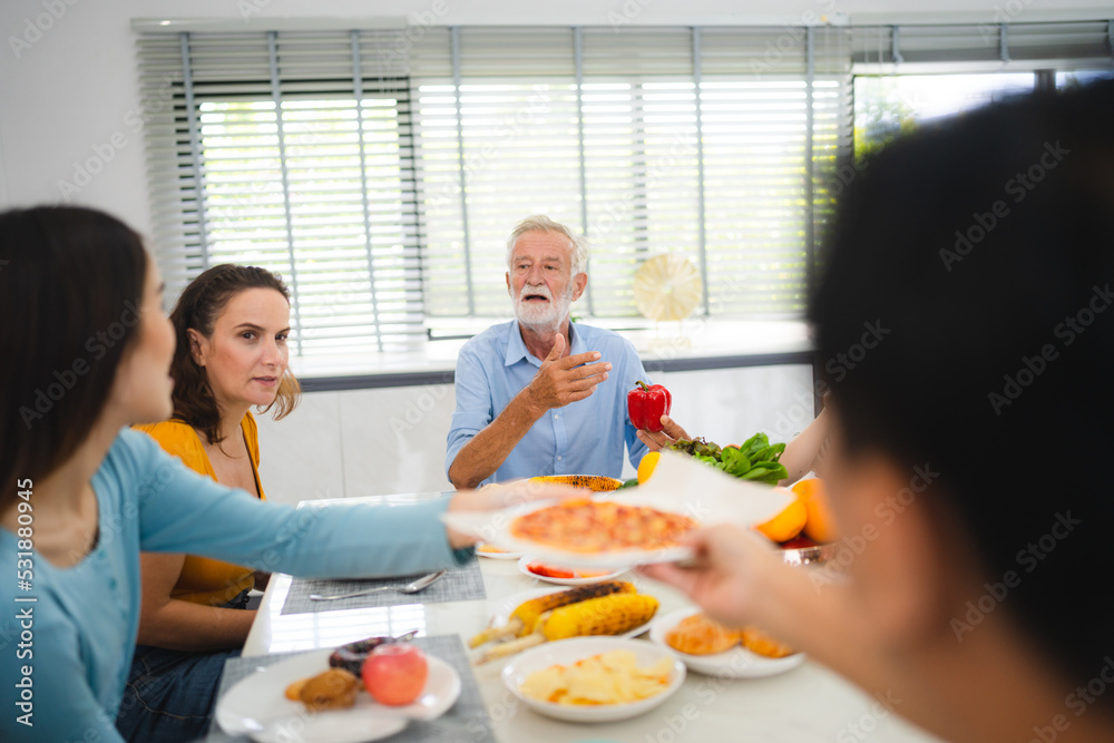 Photo of big family at home, people sit feast dishes table around roasted turkey multi-generation relatives making group with food and pizza in house living room indoors