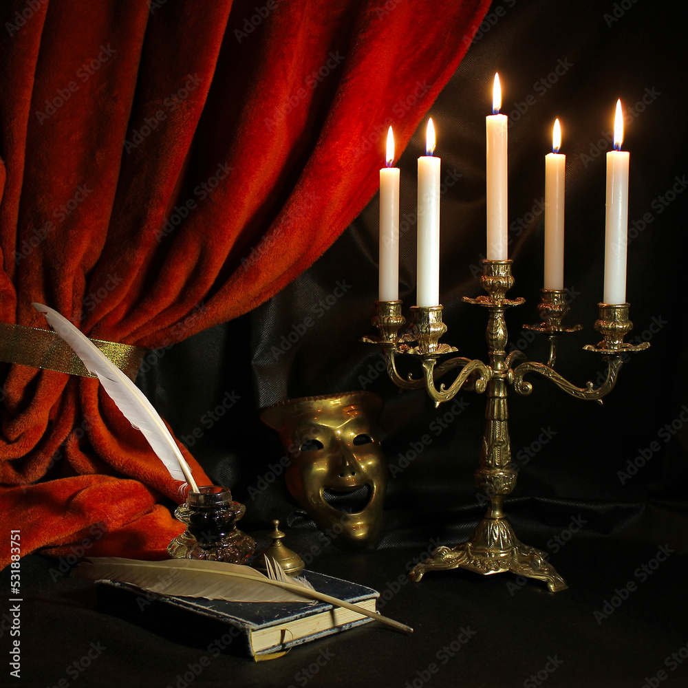  Dramatist's workplace with quill, ink, candelabra, antique book and theatrical mask with dark red curtain. Vintage writing set concept.  - obrazy, fototapety, plakaty 
