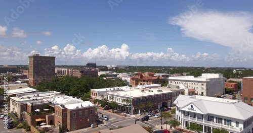 Drone shot over historic downtown Pensacola in Florida on a partly cloudy and sunny day