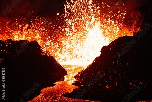 Beautiful shot of lava splashing from a volcano at night in Iceland