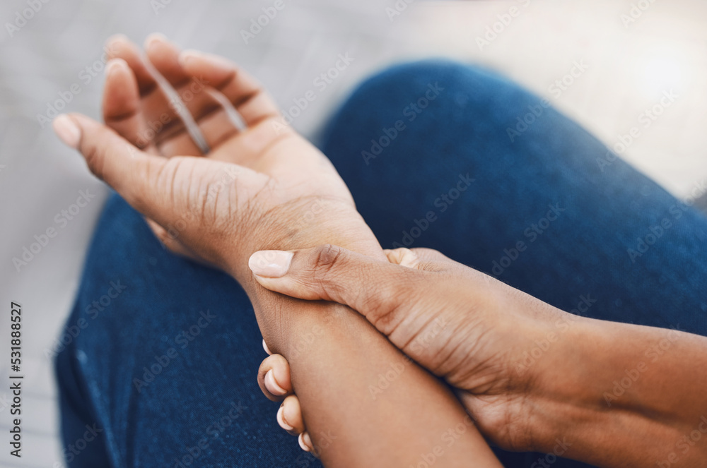 Hands, arm injury or pain of black woman after working hard in home or house interior. Hand, health and wellness of African female injured wrist after work on pc computer, carpal tunnel or arthritis.