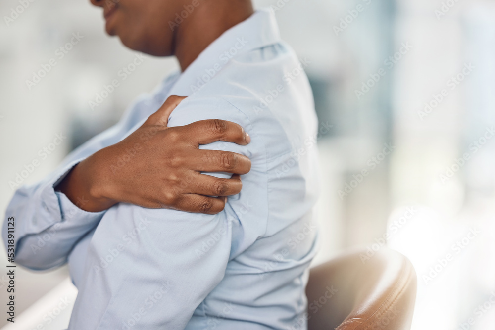 Black woman, shoulder pain and office injury from stress, burnout and target pressure. Zoom on hand, business worker or employee worried about muscle pressure from furniture chair and working posture