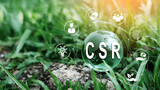 Corporate and community social responsibility give back CSR icon concept on green nature background.