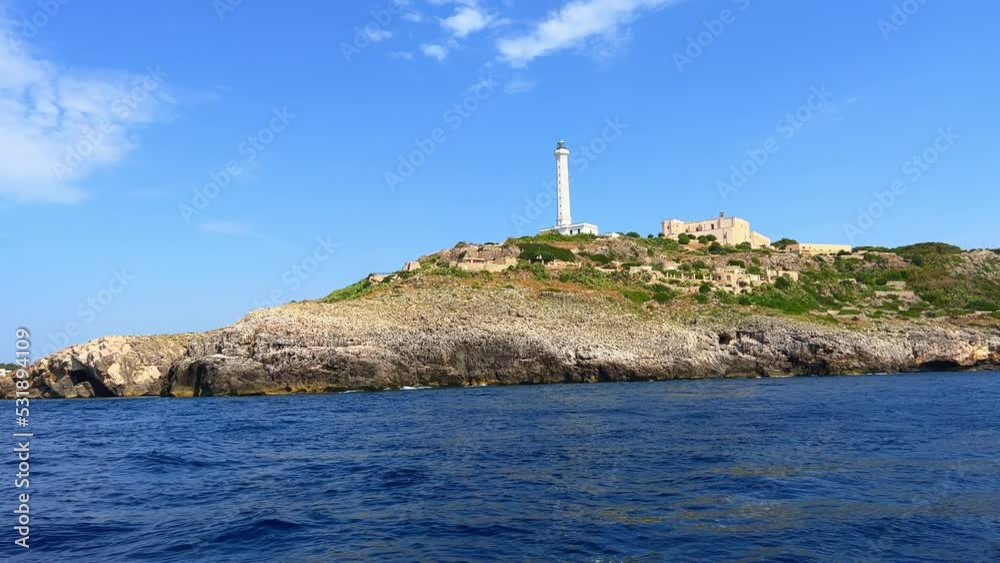 Santa Maria di Leuca white lighthouse seen from sailing boat moving along Ionian coast of Salento in Apulia, Italy Santa Maria di Leuca white lighthouse seen from sailing boat moving along Ionian coast of Salento in Apulia, Italy