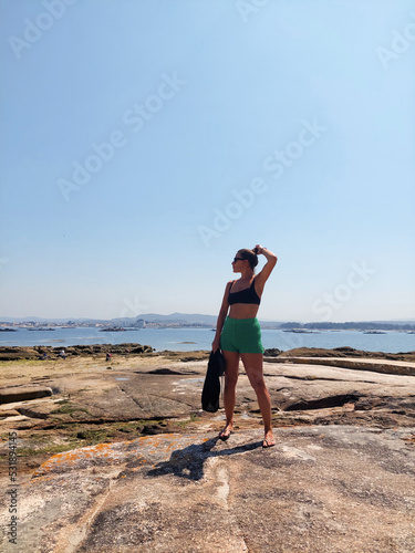 family walking on the rocks on the beach