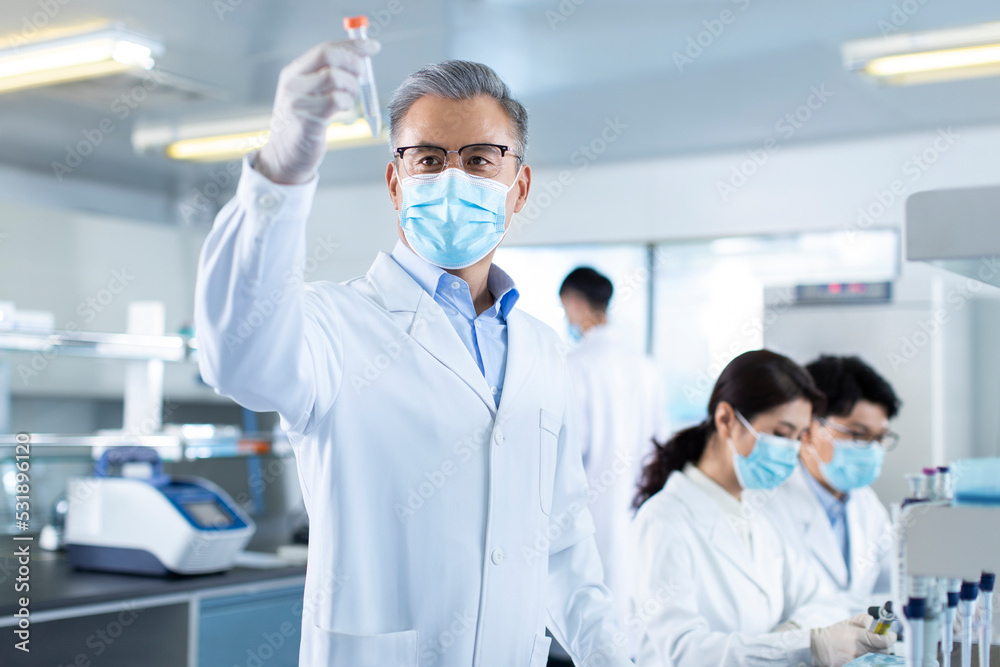 Scientists examining medical sample in laboratory Scientists examining medical sample in laboratory