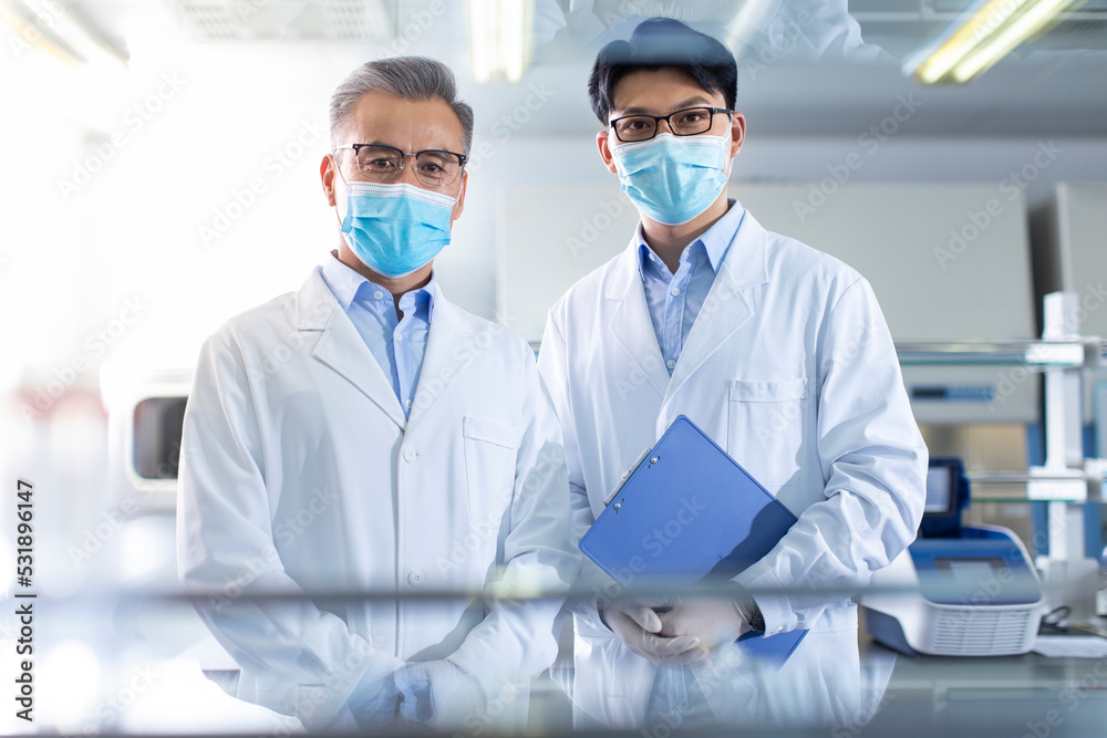 Portrait of male researchers in laboratory Portrait of male researchers in laboratory