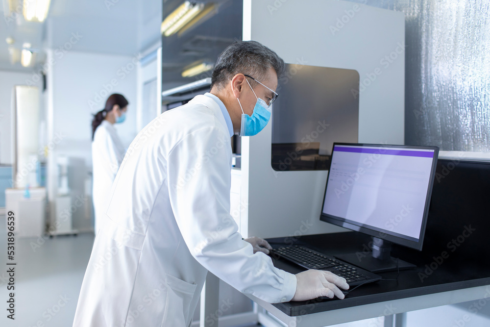 Two researchers working in laboratory Two researchers working in laboratory