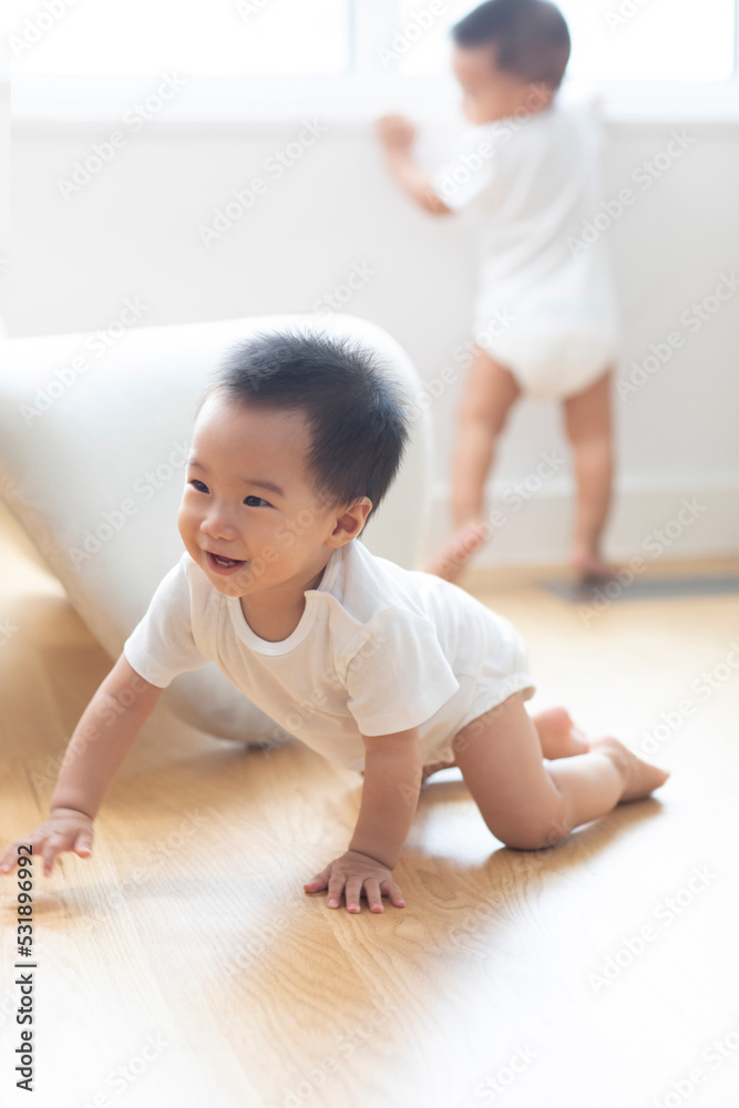 Cute twin babies playing at home Cute twin babies playing at home