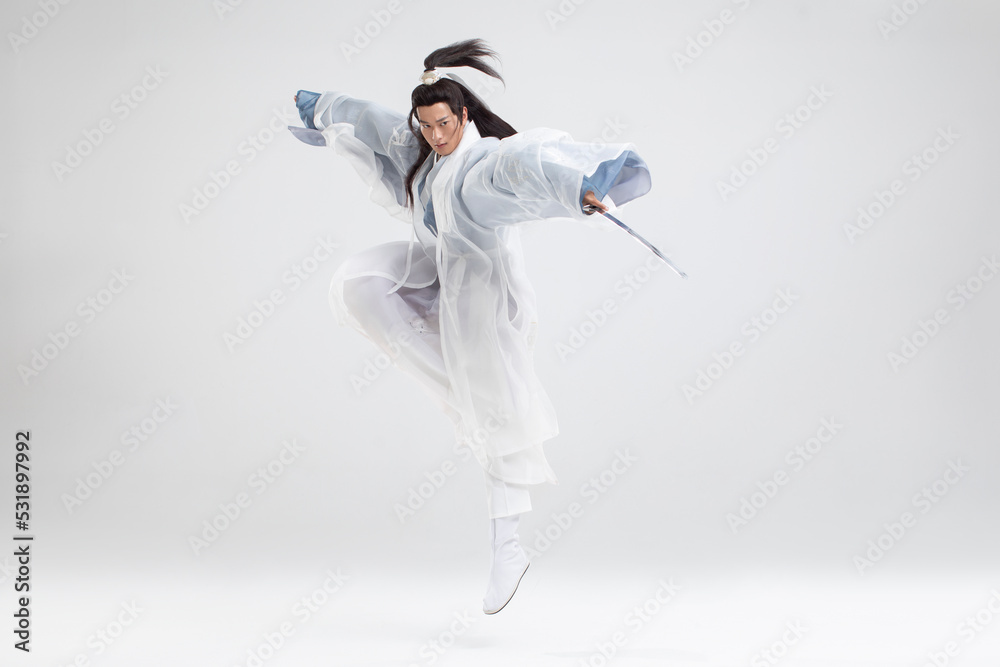 Young swordsman in ancient costume