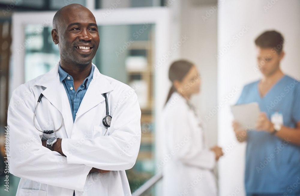 Medical, healthcare and arms crossed with doctor in hospital for vision, trust and leadership. Support, innovation and motivation with black man employee in medicine, surgery and first aid clinic Medical, healthcare and arms crossed with doctor in hospital for vision, trust and leadership. Support, innovation and motivation with black man employee in medicine, surgery and first aid clinic