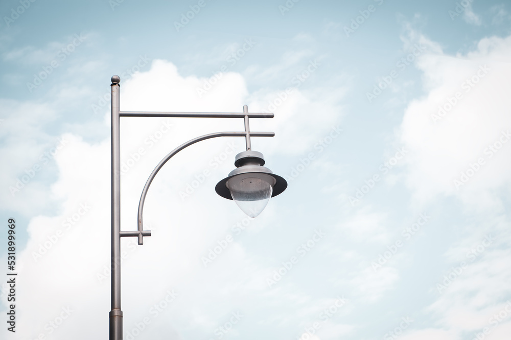 city lantern with a dark pillar against the sky city lantern with a dark pillar against the sky