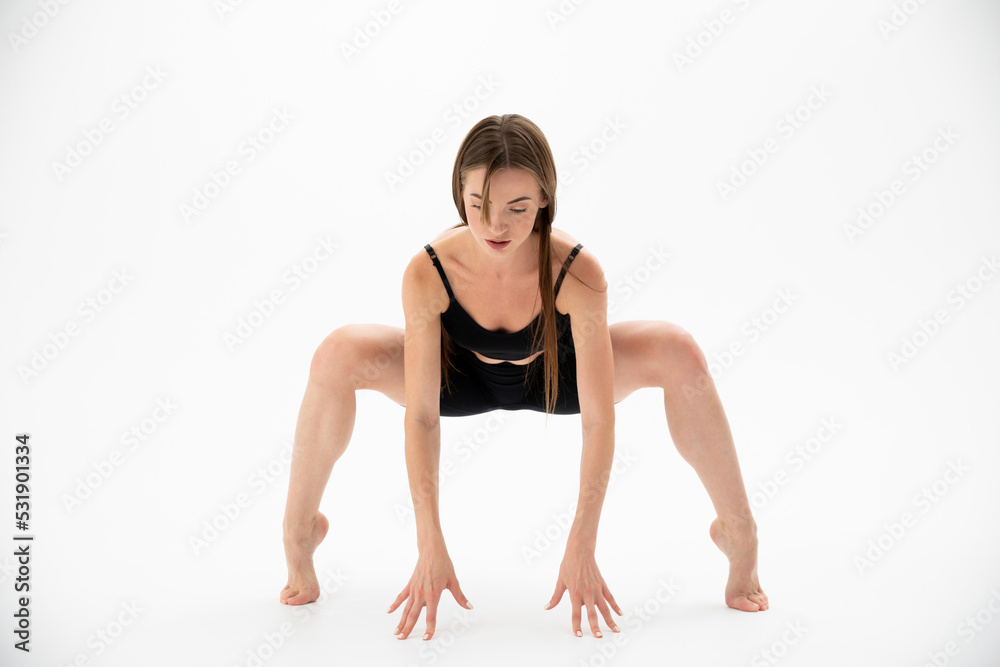 Beautiful girl in sportswear doing yoga Beautiful girl in sportswear doing yoga