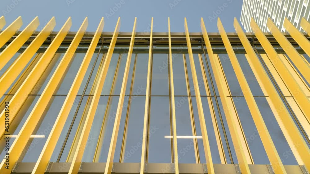 Architectural details and geometric window pattern on modern high-rise building Architectural details and geometric window pattern on modern high-rise building