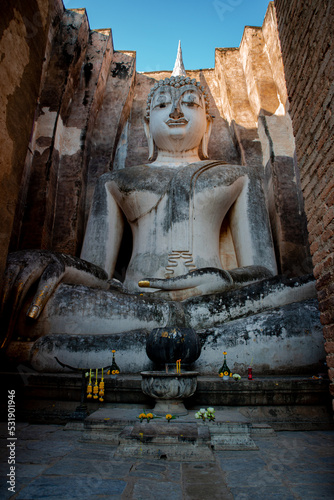 Ancient city of Sukhothai historical sites with ruins of Buddhist Temple Wat Si Chum and Wat Mahathat at the Sukhothai Historical Park, Thailand