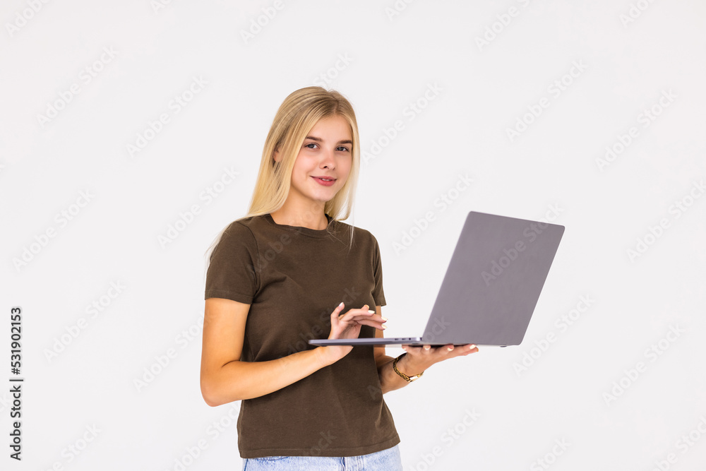 Portrait of a happy businesswoman working on laptop computer isolated over white background Portrait of a happy businesswoman working on laptop computer isolated over white background