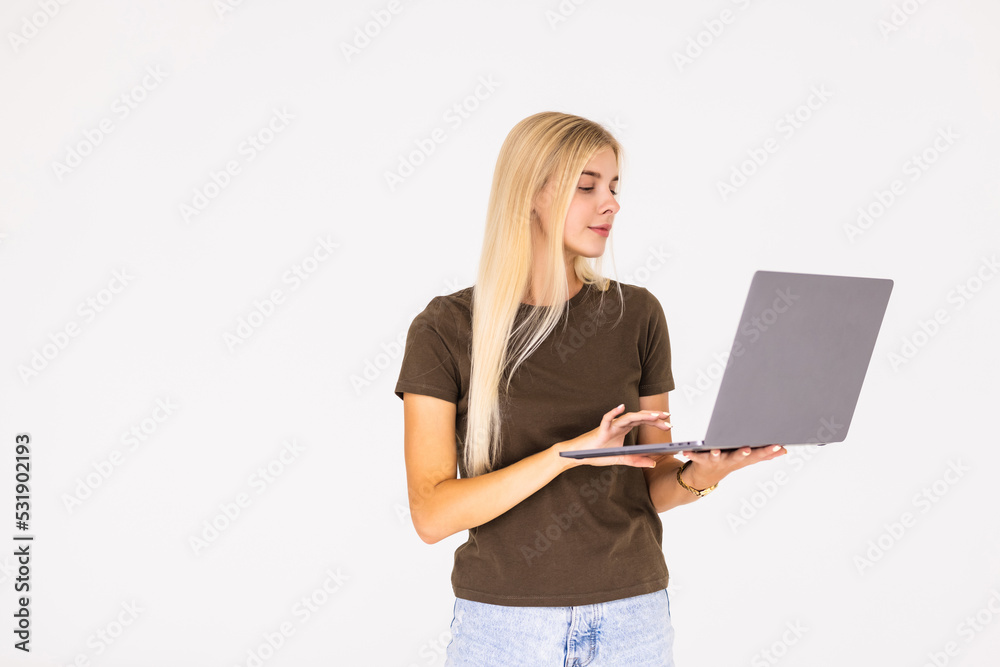 Portrait of a happy businesswoman working on laptop computer isolated over white background Portrait of a happy businesswoman working on laptop computer isolated over white background