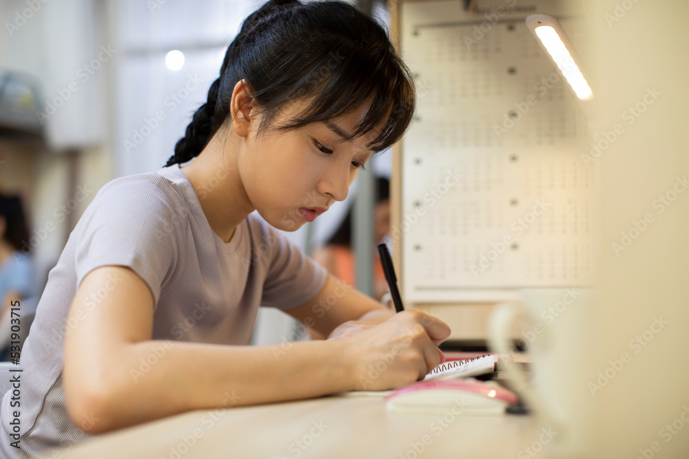 Young university student learning in dormitory Young university student learning in dormitory