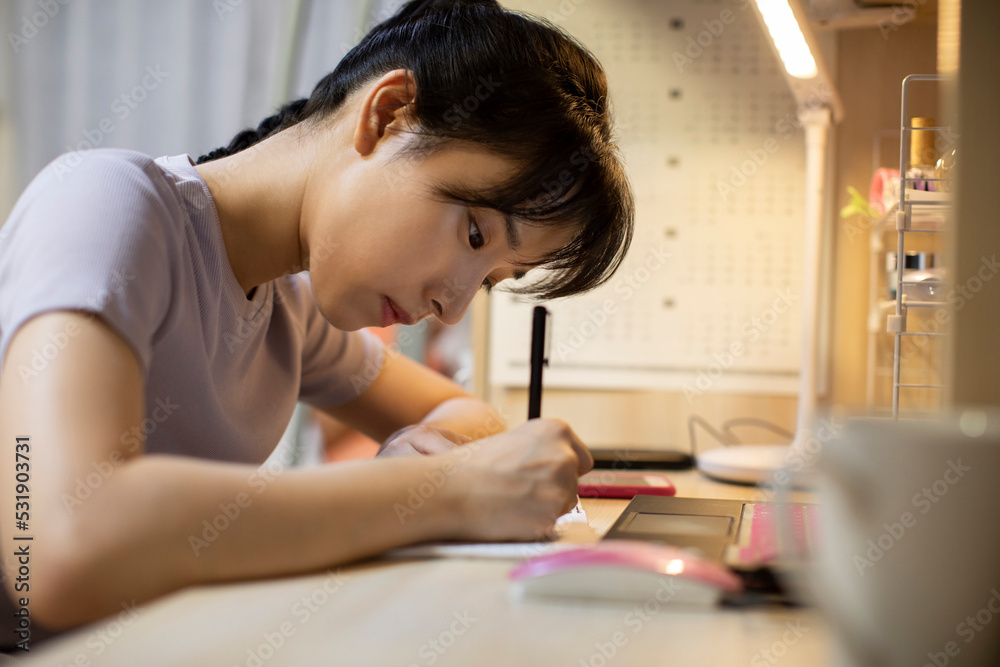 Young university student learning in dormitory Young university student learning in dormitory