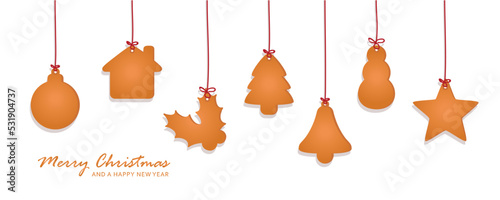 christmas card with hanging gingerbread cookies decoration on blue background