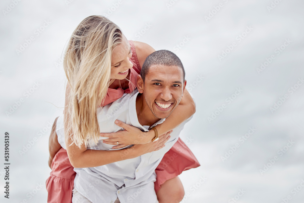 Love, freedom and couple embrace at beach, happy and relax on summer vacation together. Portrait of interracial man and woman enjoy playful relationship outdoors in nature, having fun bonding on trip Love, freedom and couple embrace at beach, happy and relax on summer vacation together. Portrait of interracial man and woman enjoy playful relationship outdoors in nature, having fun bonding on trip