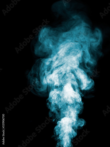 Thick turquoise smoke on a black background, rising tubers upwards as an abstract effect