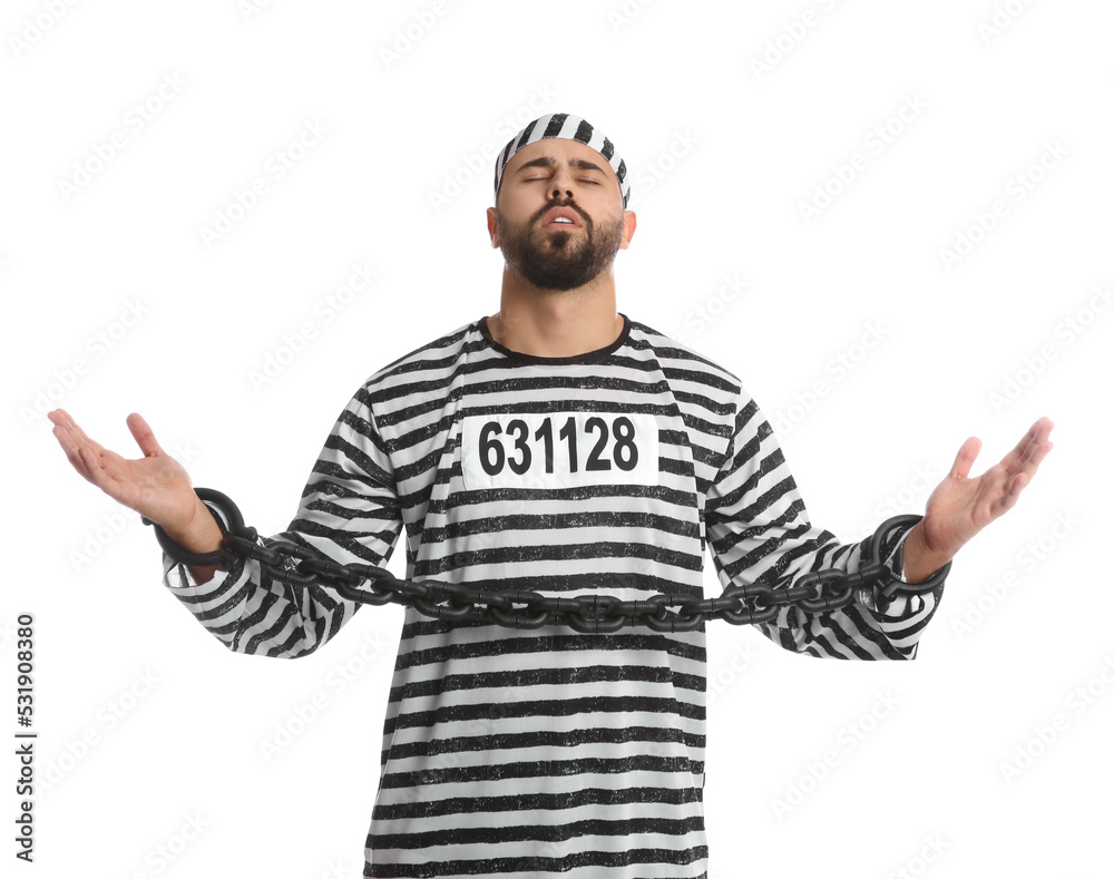 Prisoner in special uniform with chained hands on white background Prisoner in special uniform with chained hands on white background