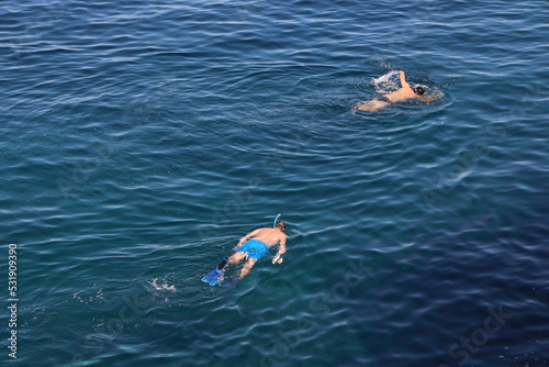 Men snorkeling in the sea