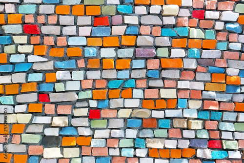 Bright colorful mosaic vintage brick stones horizontal textured background.