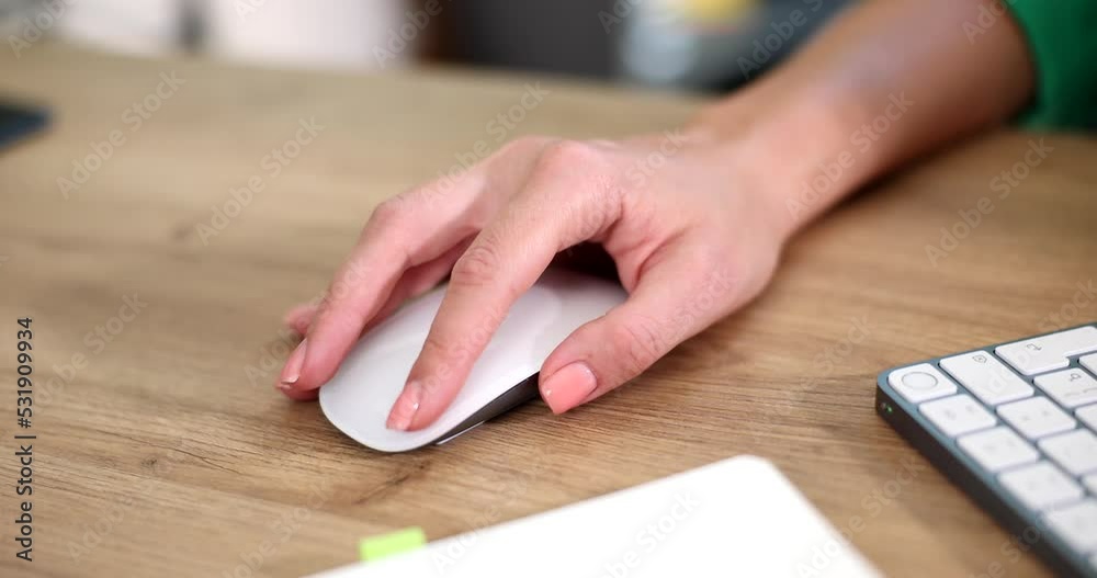 Hand of programmer moving computer mouse at table closeup 4k movie slow motion