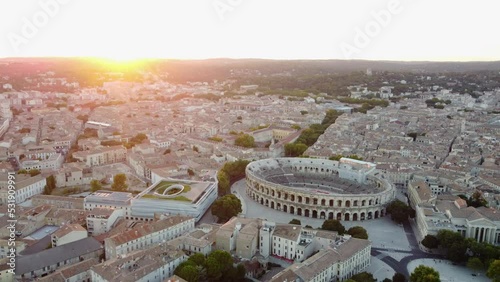 Aerial Pullback Arena of Nimes, Roman Amphitheater with Sunset Sky. photo
