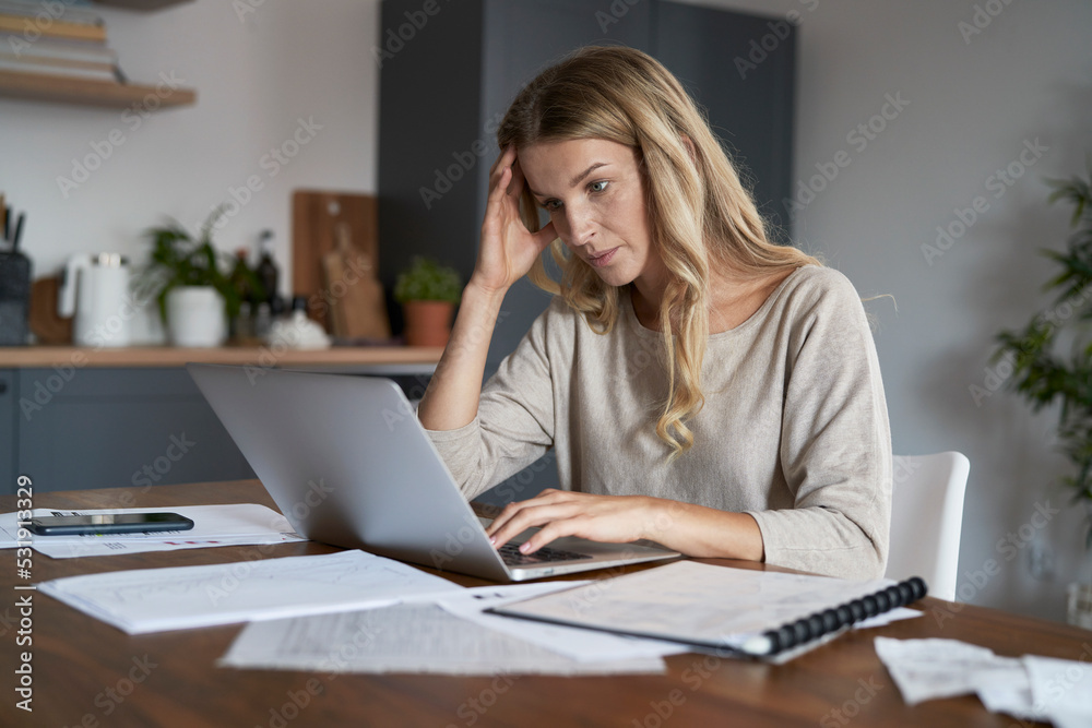 Caucasian woman frustrated with financial problems