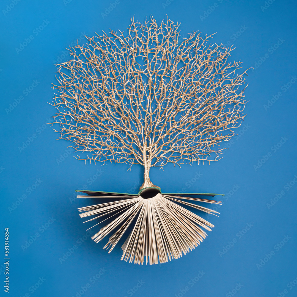 Golden tree growing from the old book, Education and knowledge concept. For book lovers. Flat lay. - obrazy, fototapety, plakaty 