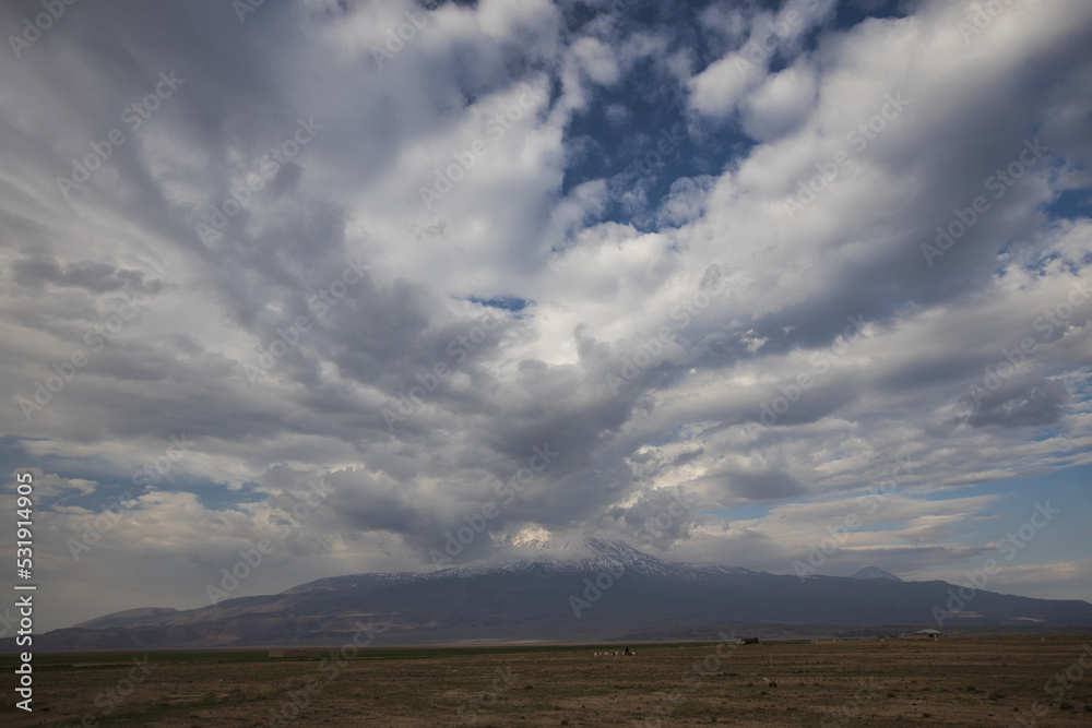 clouds in the sky and the snowy peaks of Mount Ararat clouds in the sky and the snowy peaks of Mount Ararat