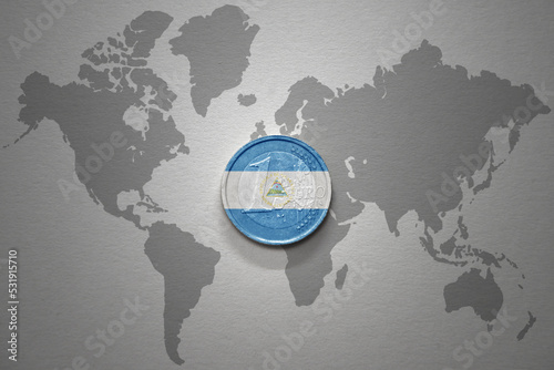 euro coin with national flag of nicaragua on the gray world map background.3d illustration.