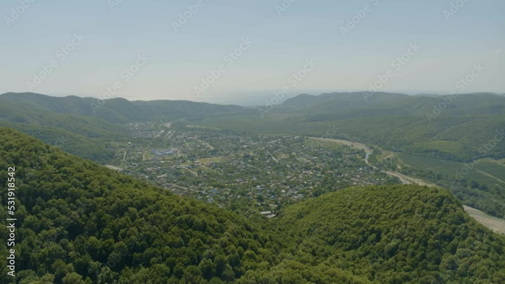 Flight over the green hills. Aerial video filming from a drone. Valley in the fog in the background. Landscape. Flight over the green hills. Aerial video filming from a drone. Valley in the fog in the background. Landscape.