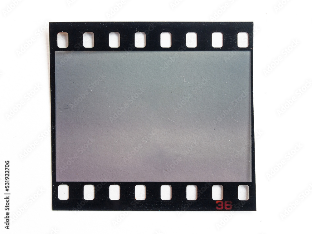 single 35mm dia film snip on white paper background, cool photo placeholder.