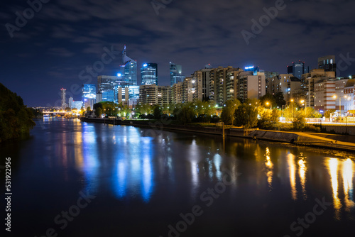 View of the La Defense business district in Paris by night, France