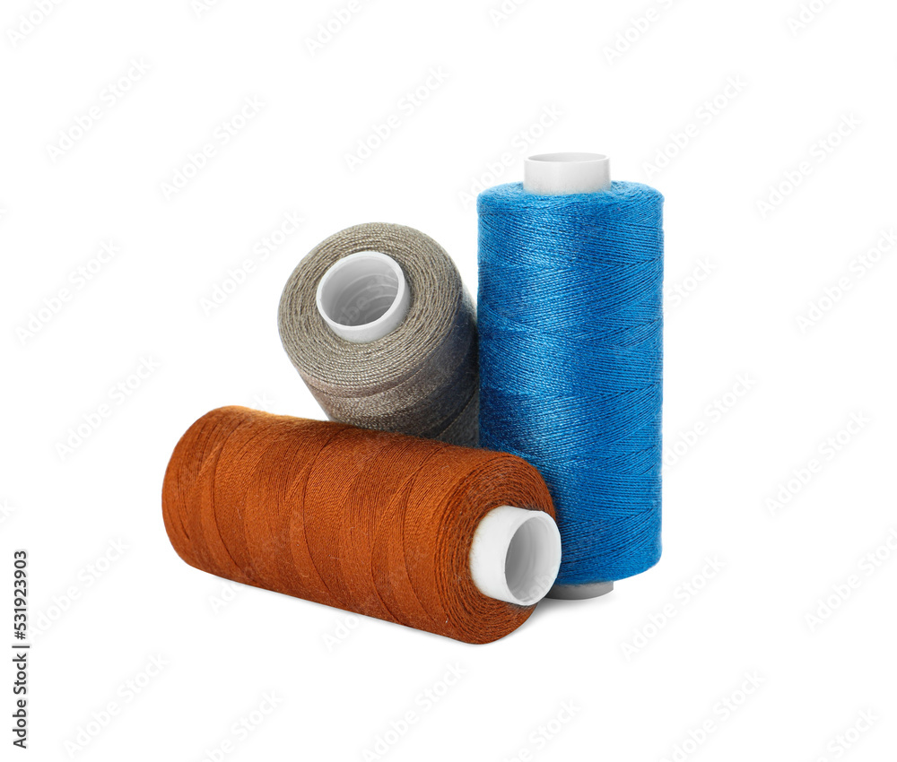 Different colorful sewing threads on white background Different colorful sewing threads on white background