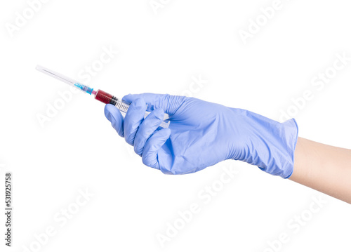 Hand with blue nitrile glove is holding syringe with red liquid, in front of white background. Blood in syringe. Medical syringe with dark liquid. Drugs. Vitamins. Medicines.