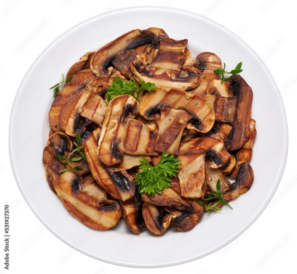 Grilled Slices of champignon mushrooms with stripes from a grill in ceramic plate Grilled Slices of champignon mushrooms with stripes from a grill in ceramic plate