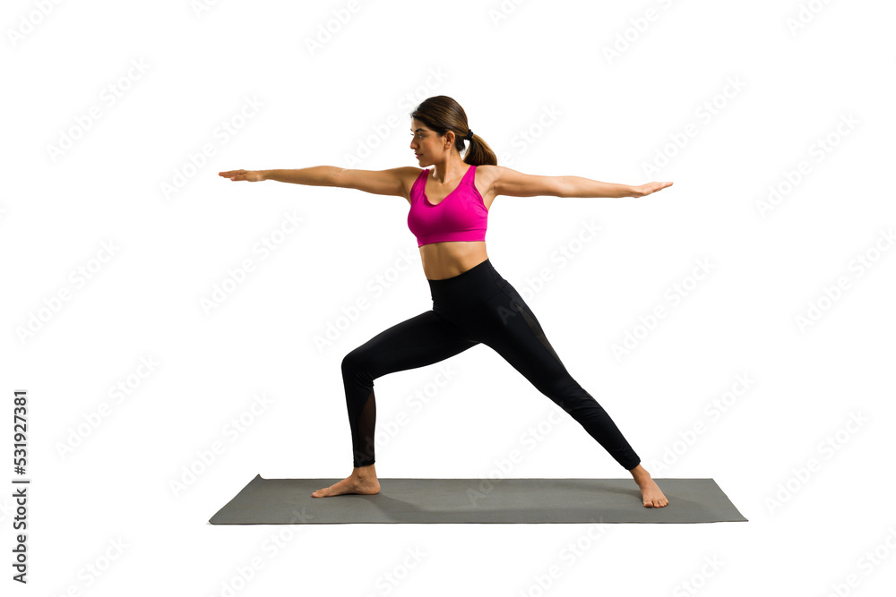 Happy young woman enjoying her yoga exercises