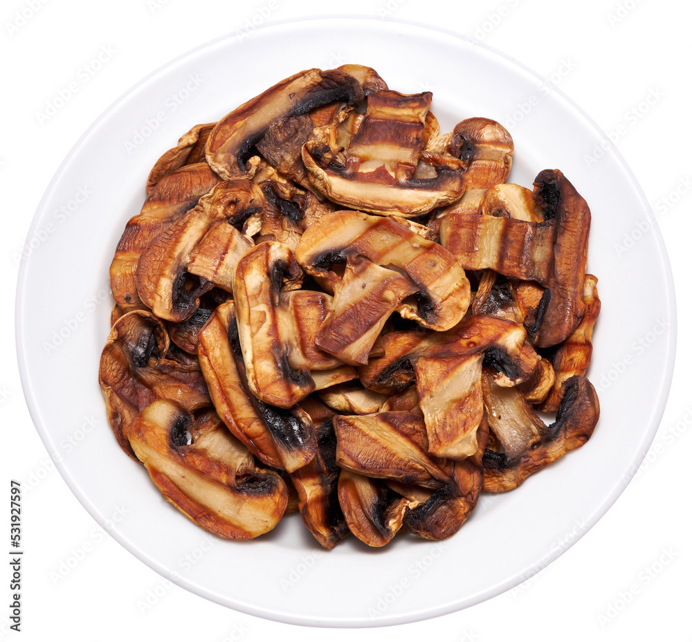 Grilled Slices of champignon mushrooms with stripes from a grill in ceramic plate Grilled Slices of champignon mushrooms with stripes from a grill in ceramic plate