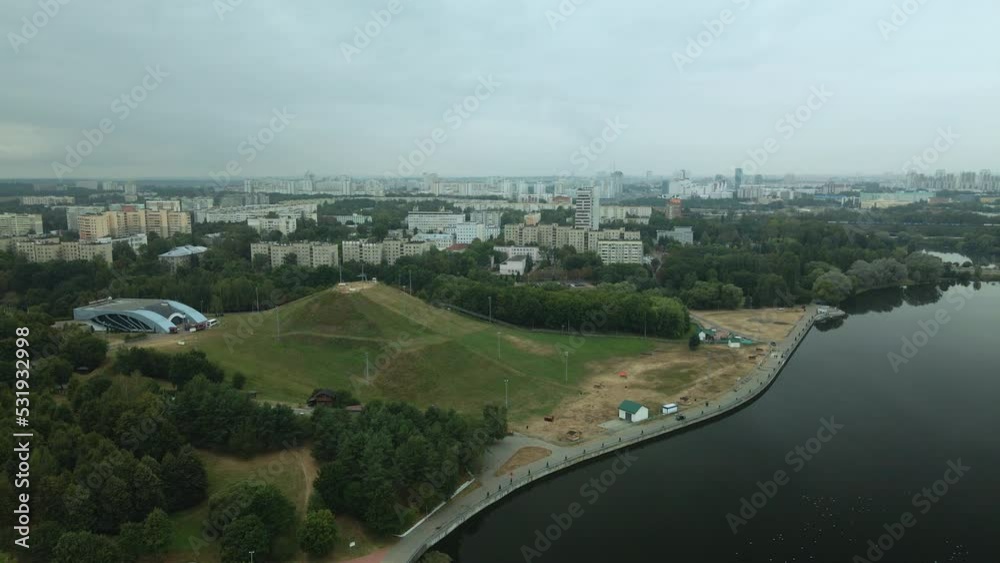Lake in the city park. Ski center hill. Urban landscape. Sleeping area of a big city. Aerial photography Lake in the city park. Ski center hill. Urban landscape. Sleeping area of a big city. Aerial photography