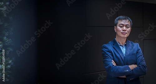 Portrait confident businessman with arms crossed photo