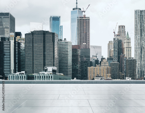 Empty concrete rooftop on the background of a beautiful New York city skyline at sunset  mock up