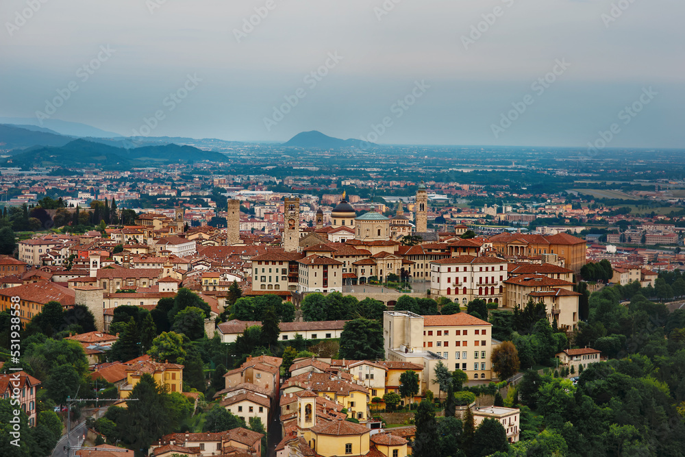 Aerial panoramic view to Bergamo, Italy, landscape of old town with towers, churches, cathedral, red roofs, sightseeings, typical european italian architecture