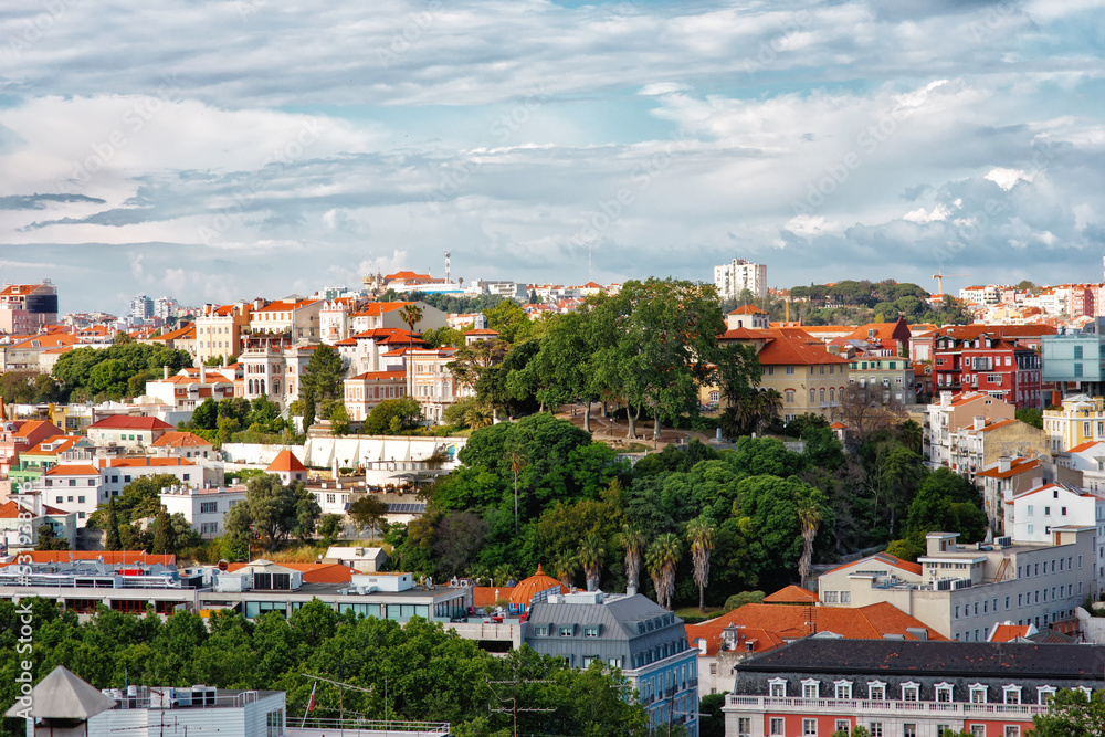 Panoramic view of old city center of Lisbon, Portugal from viewpoint: historical buildings, red roofs, european urban landscape