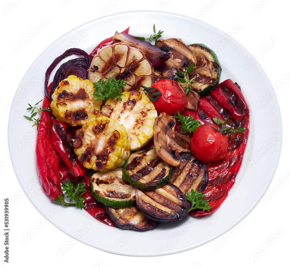 Grilled vegetables mix on a ceramic plate - zucchini eggplant onions corn mushroom tomato Grilled vegetables mix on a ceramic plate - zucchini eggplant onions corn mushroom tomato
