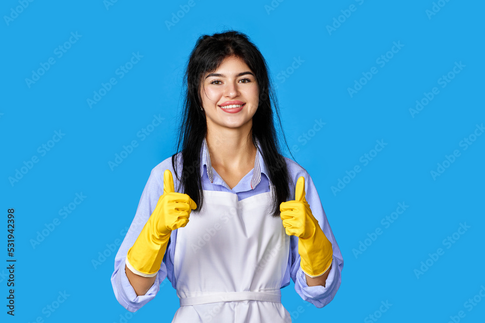 woman in gloves and cleaner apron showing ok sign woman in gloves and cleaner apron showing ok sign